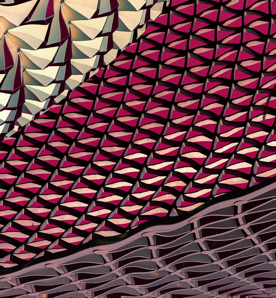 Abstract architectural facade featuring repeating geometric patterns and layered structural design.