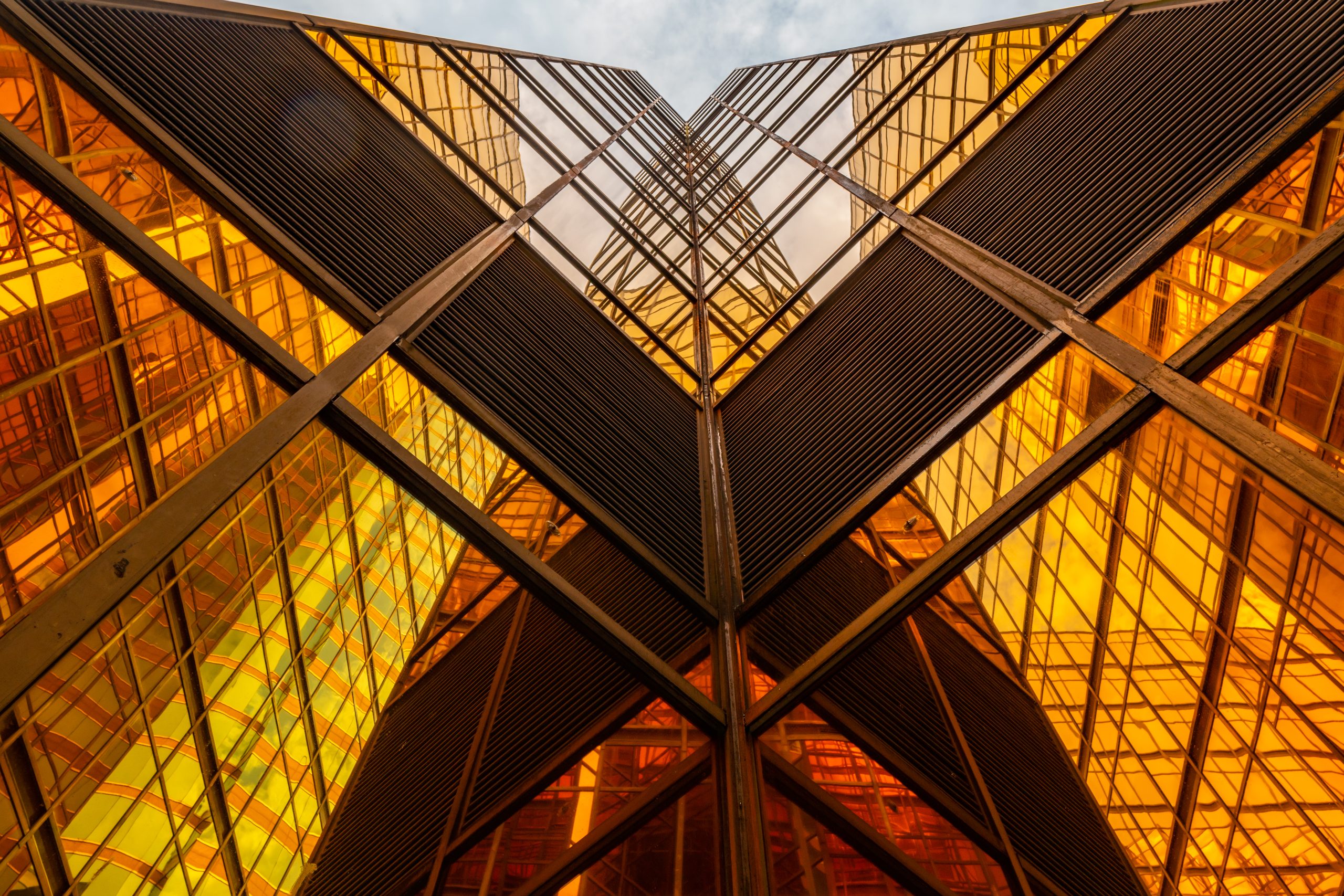 Abstract golden glass building structure symbolising growth and connection across Europe.