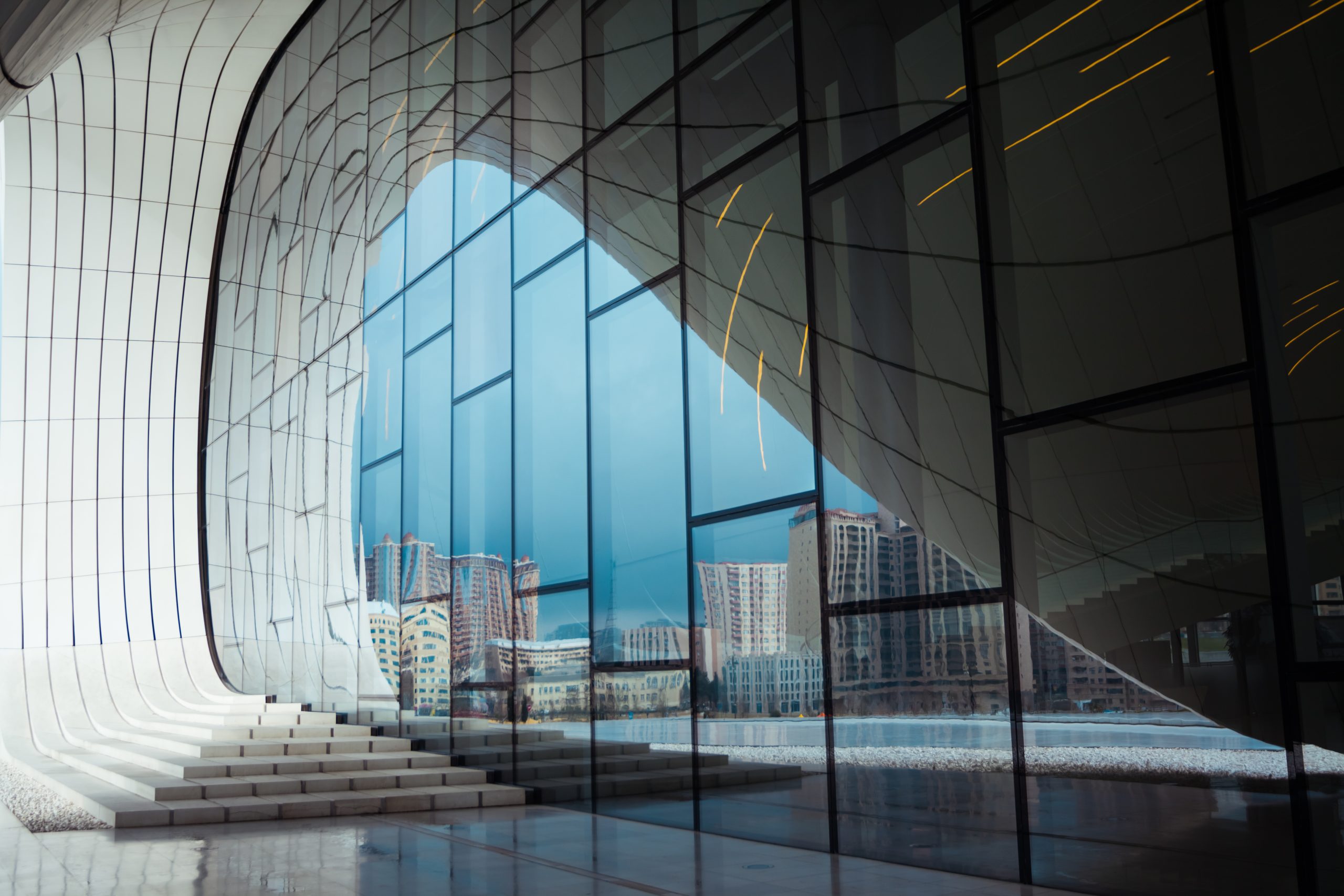 Modern glass building with curved architectural design for PKF Broking Business.