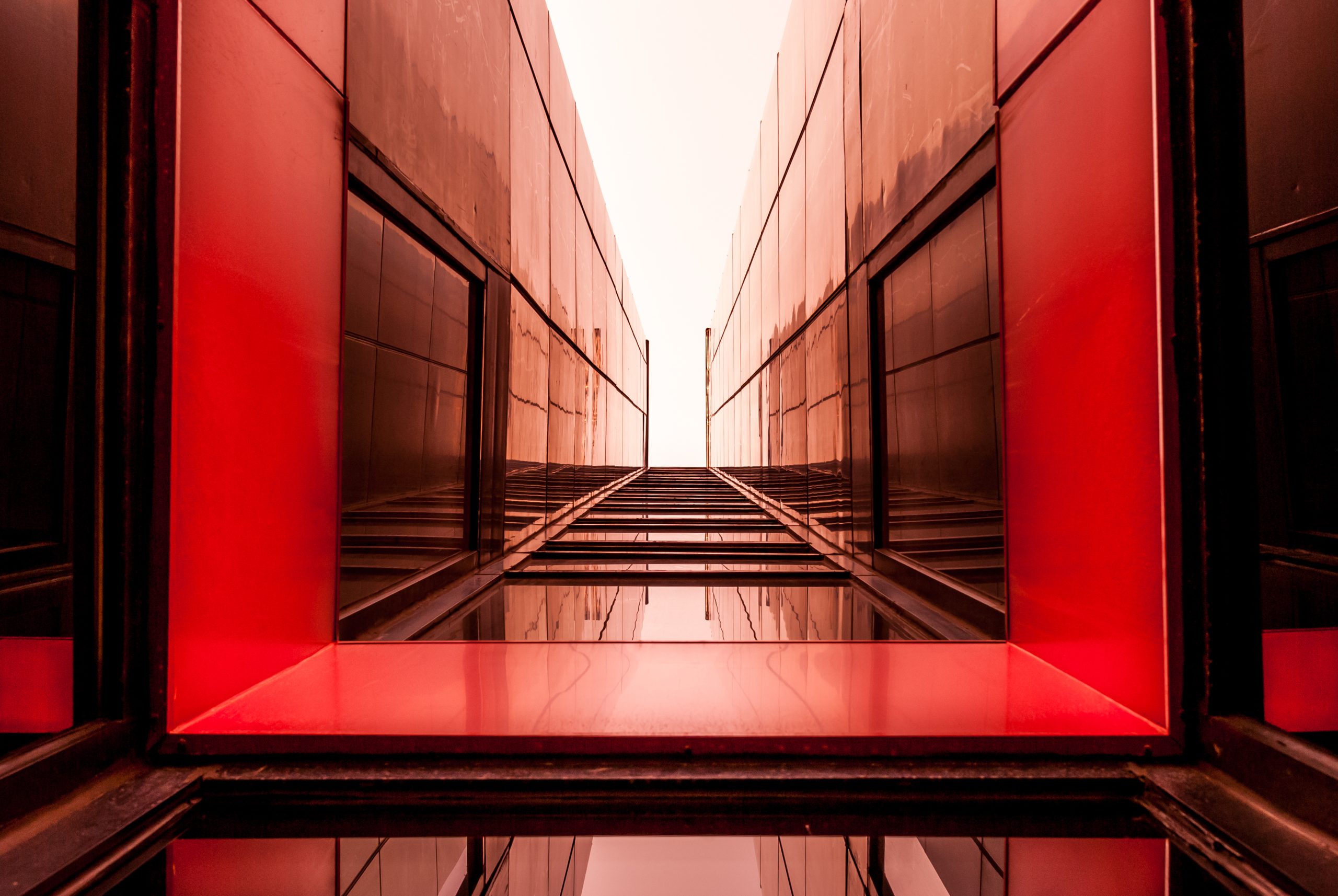 Abstract red architectural corridor symbolising structure