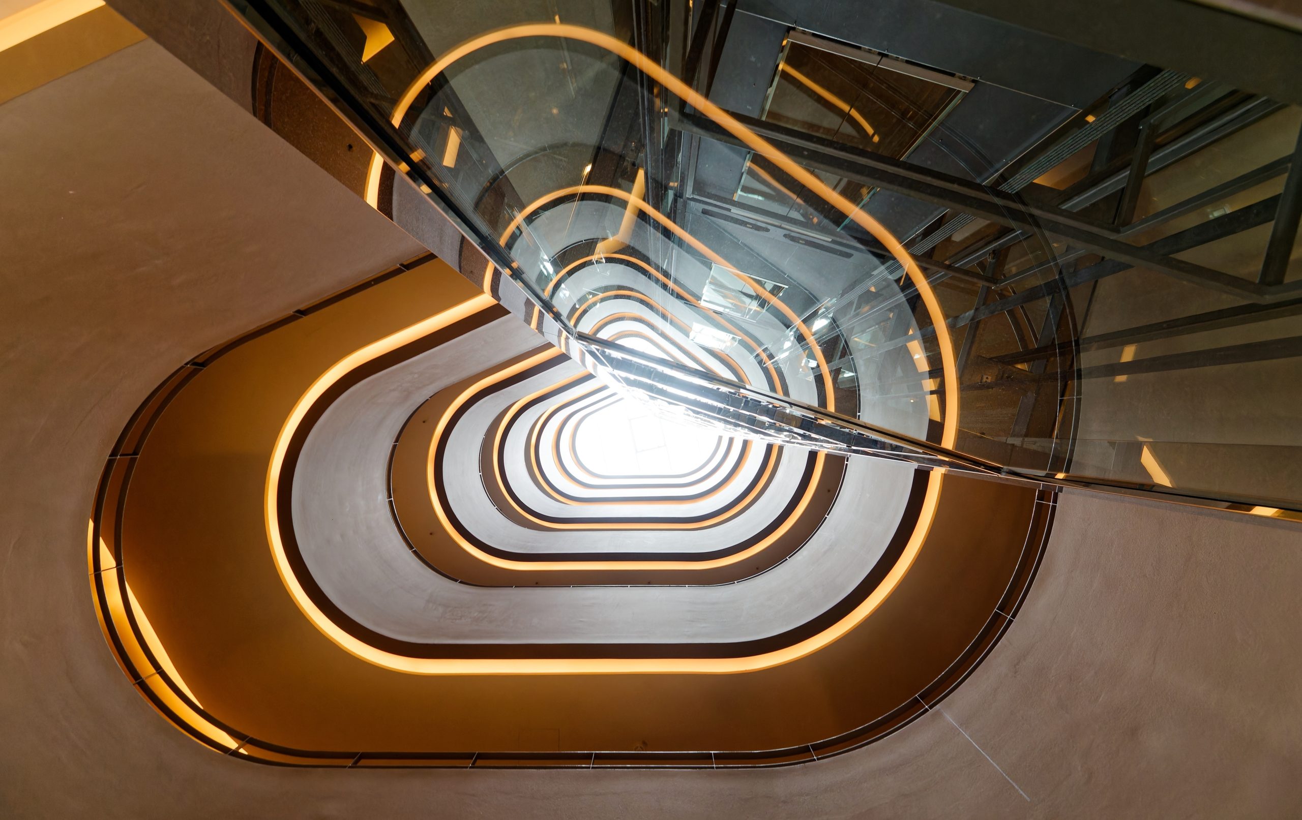Modern office staircase with curved lighting