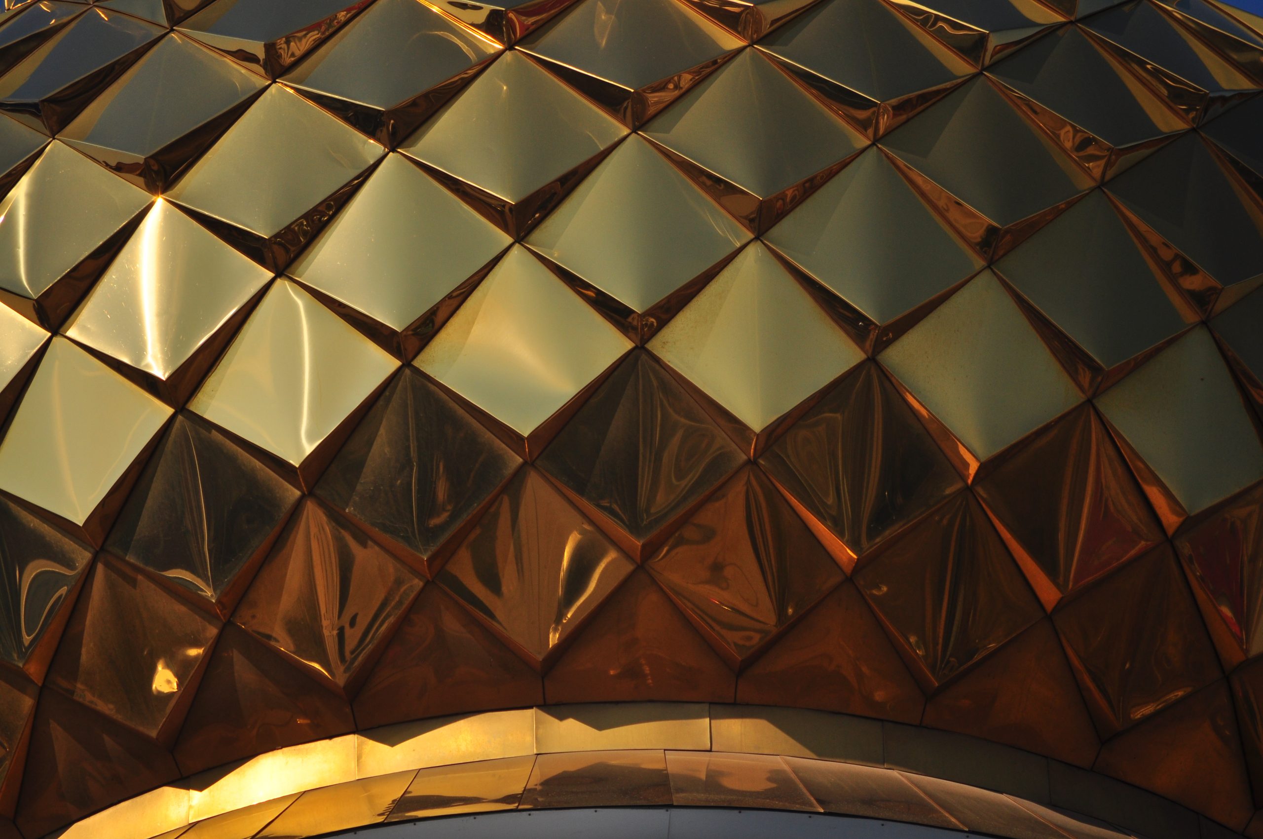 Abstract geometric gold structure representing complexity in US LLC UK tax treatment and double taxation
