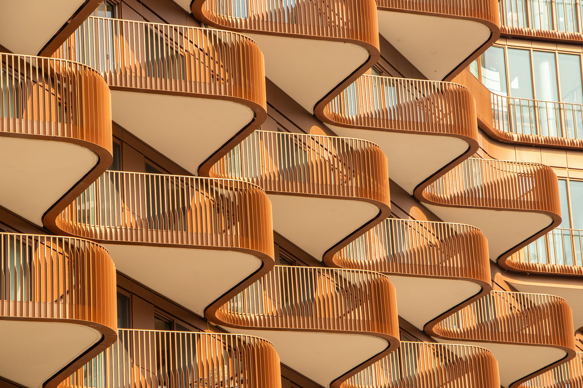 Modern office building with curved balconies and geometric architectural design