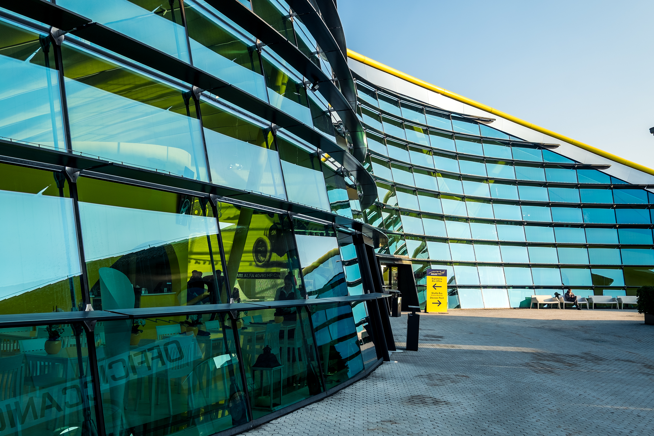 Contemporary glass office building with curved architecture